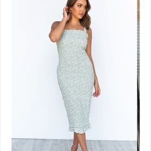 Beautiful floral smocked dress. New with tags. Not maternity but bump friendly